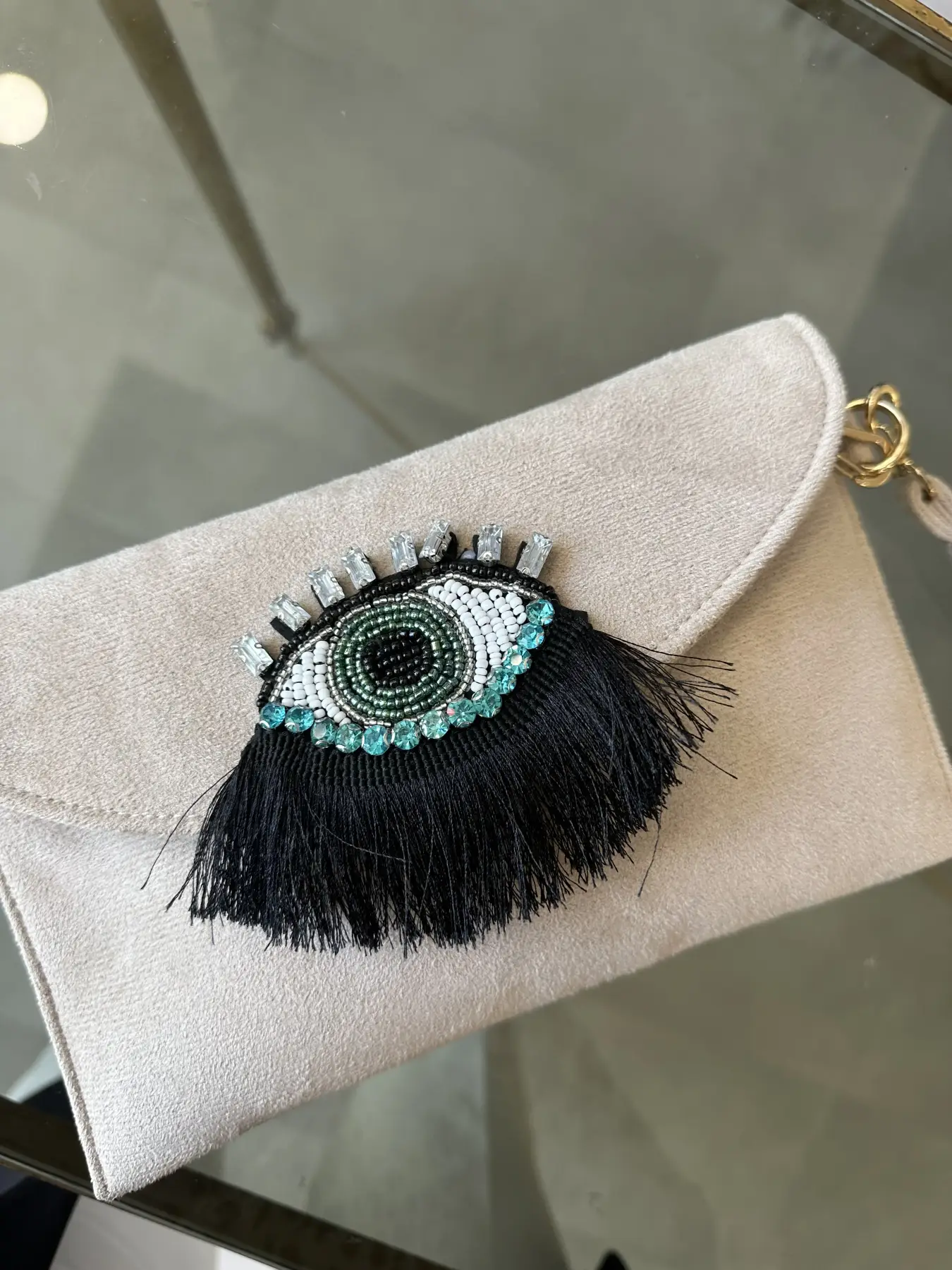 Σουέτ πορτοφόλι με λεπτομέρεια μάτι με λουράκι